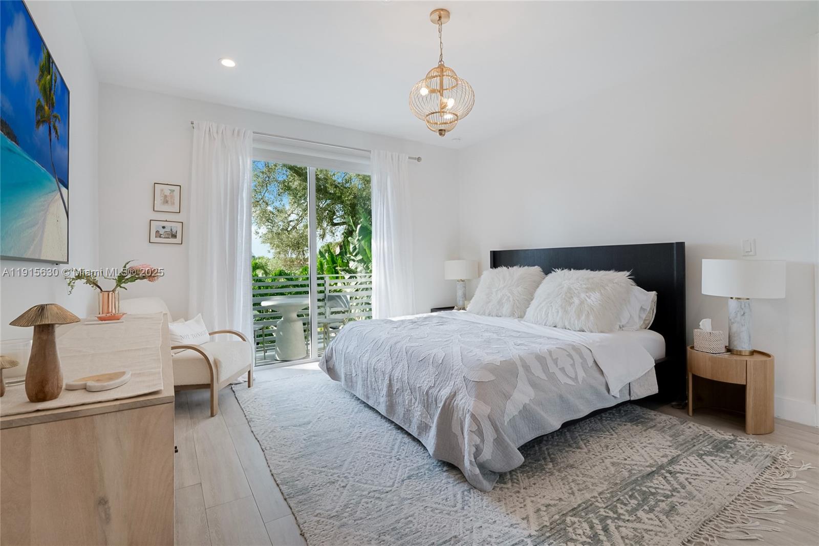 2410 Southwest 16th Avenue Miami, FL 33145 - Photo 9 of 25 a bedroom with a large bed and a window