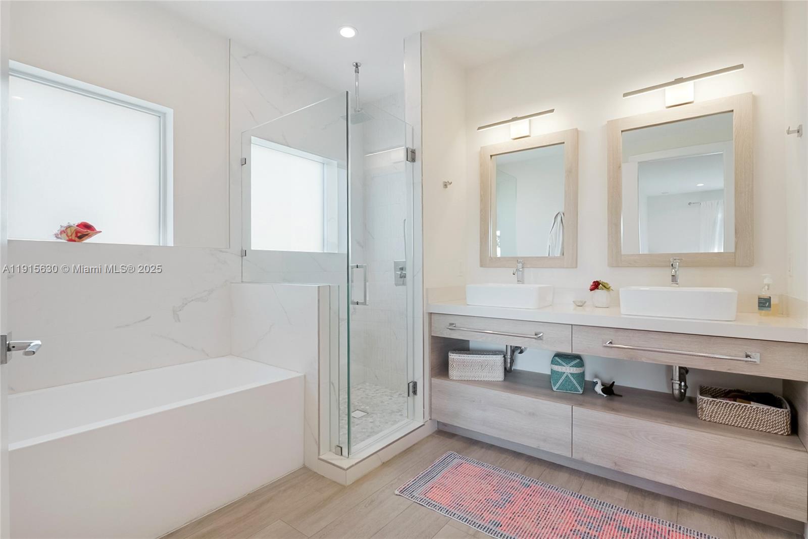 2410 Southwest 16th Avenue Miami, FL 33145 - Photo 10 of 25 a spacious bathroom with sinks mirror and a bathtub