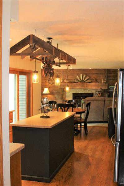 497 Cannery Road Mercer, PA 16137 - Photo 11 of 25 Kitchen into living room, shiplap siding, custom mantel with whitewashed brick!