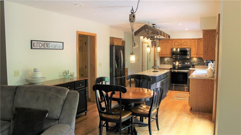 497 Cannery Road Mercer, PA 16137 - Photo 9 of 25 Open concept, kitchen counters are corian, newer appliances, rustic lighting!