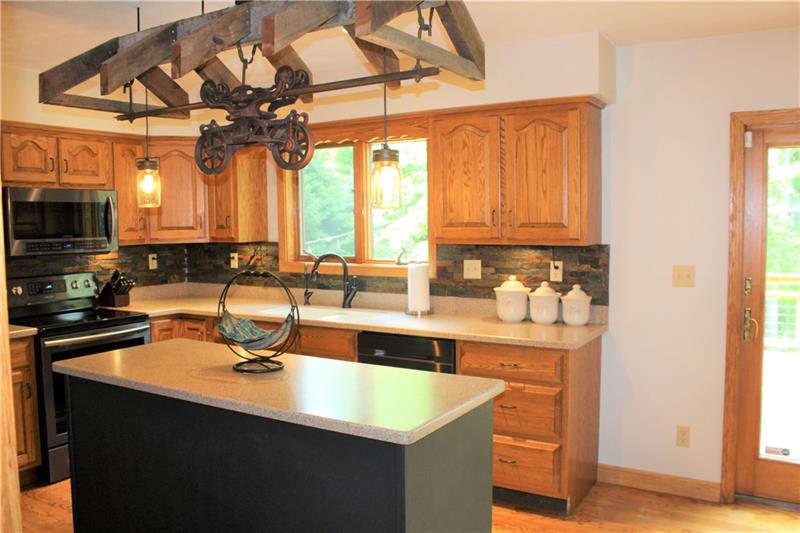 497 Cannery Road Mercer, PA 16137 - Photo 10 of 25 Oak cabinetry coupled with antique charm make the kitchen an enjoyable place to bake!