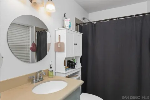 a bathroom with a sink and mirror