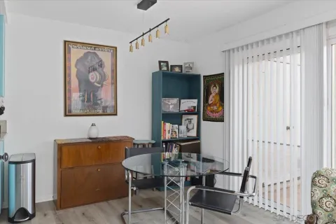 a dining room with furniture and window