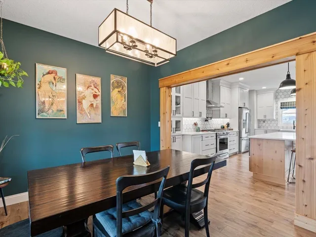 a bedroom with a bed table and a window