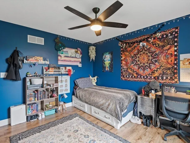 a bathroom with a toilet a sink and a mirror