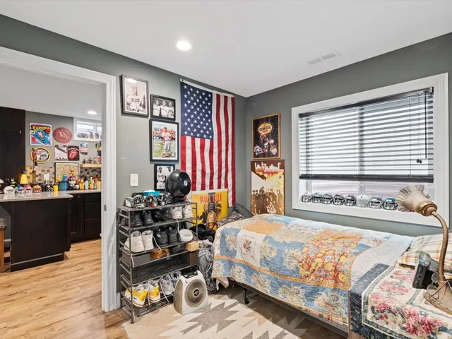 a front view of house with yard and car parked