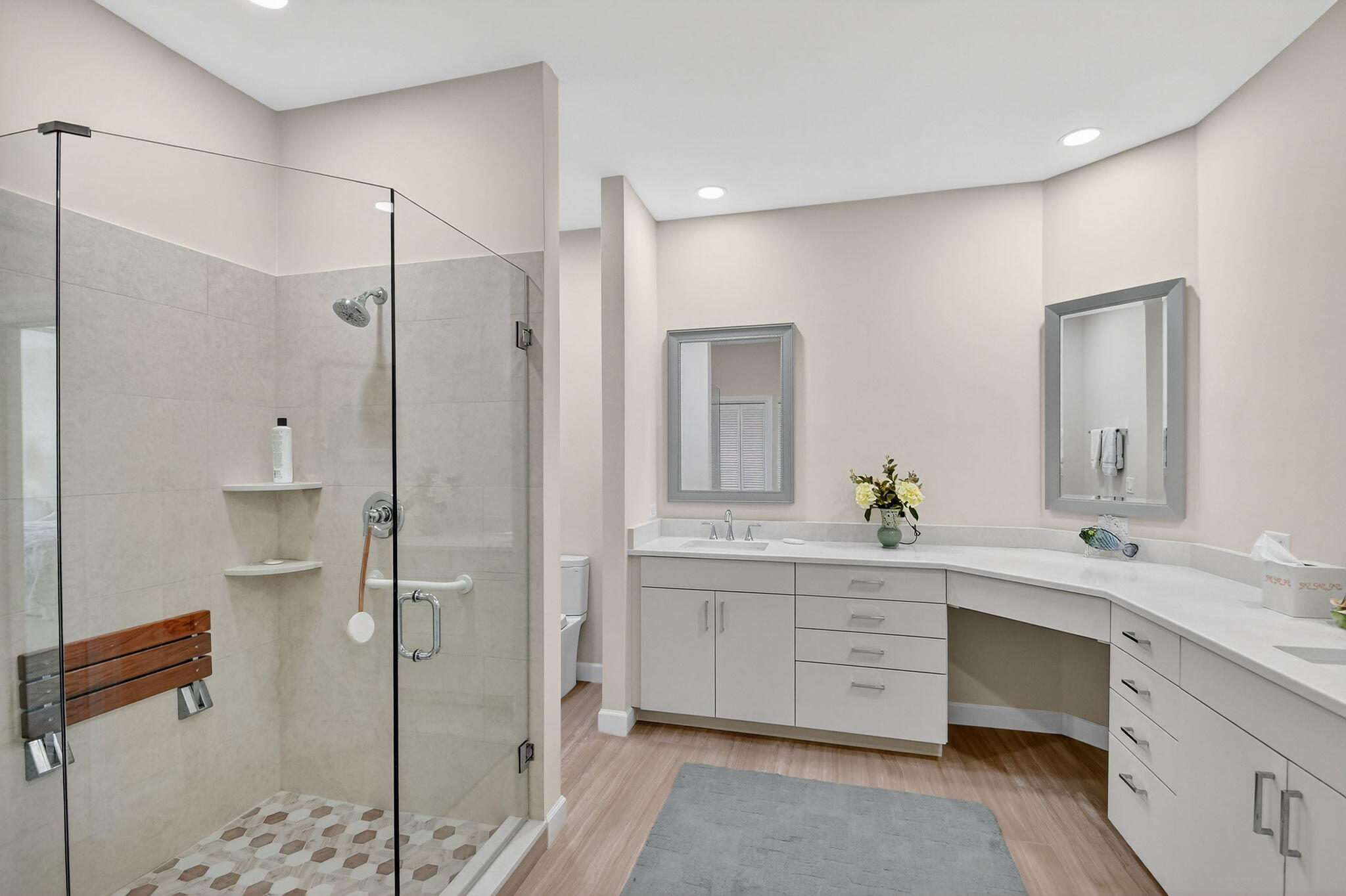 194 Orange Tree Drive, Unit G Atlantis, FL 33462 - Photo 21 of 36 a spacious bathroom with a shower sink and mirror