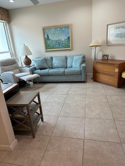 194 Orange Tree Drive, Unit G Atlantis, FL 33462 - Photo 25 of 36 a living room with furniture and a lamp