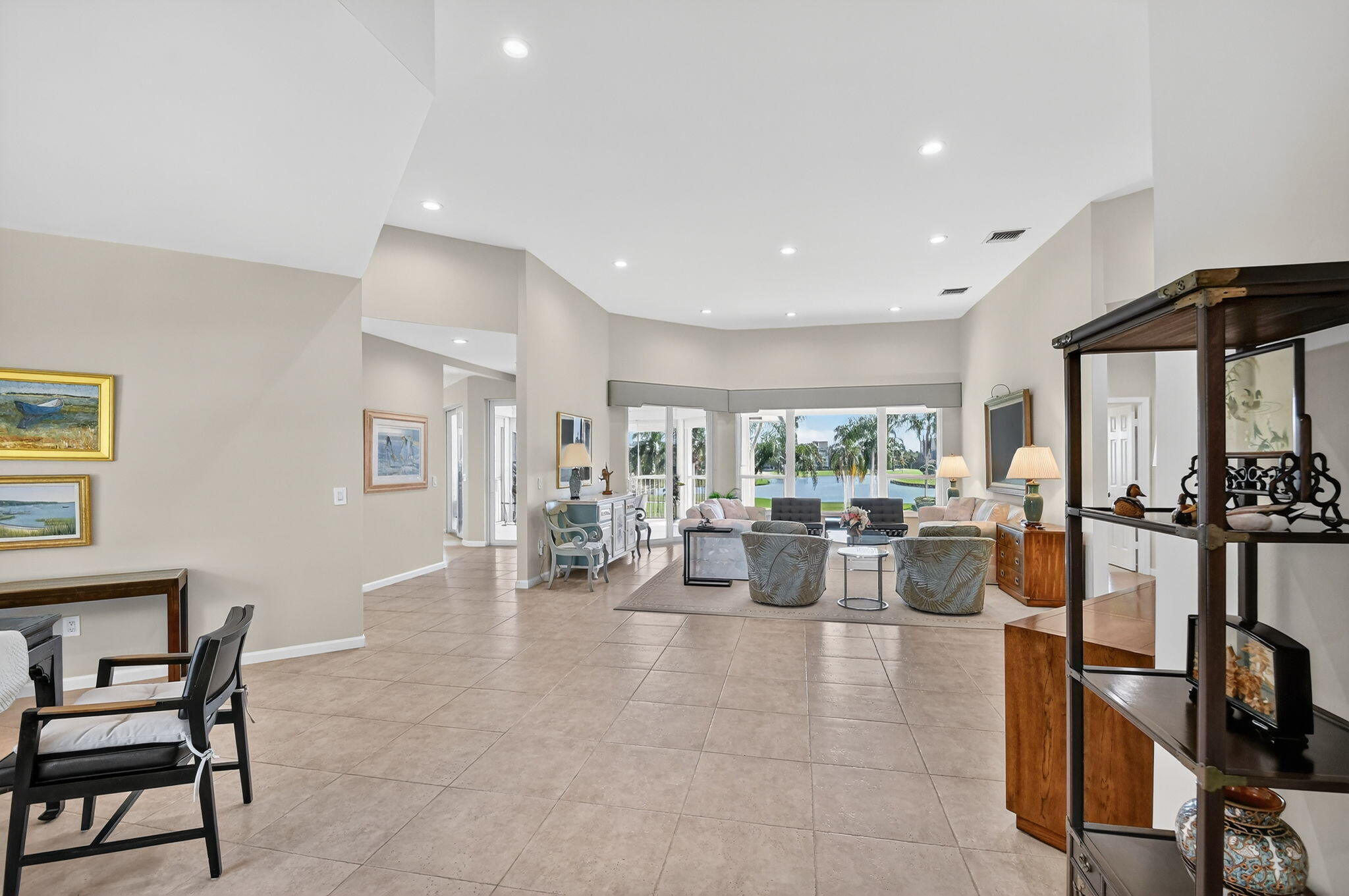 194 Orange Tree Drive, Unit G Atlantis, FL 33462 - Photo 26 of 36 a view of a living room and dining room