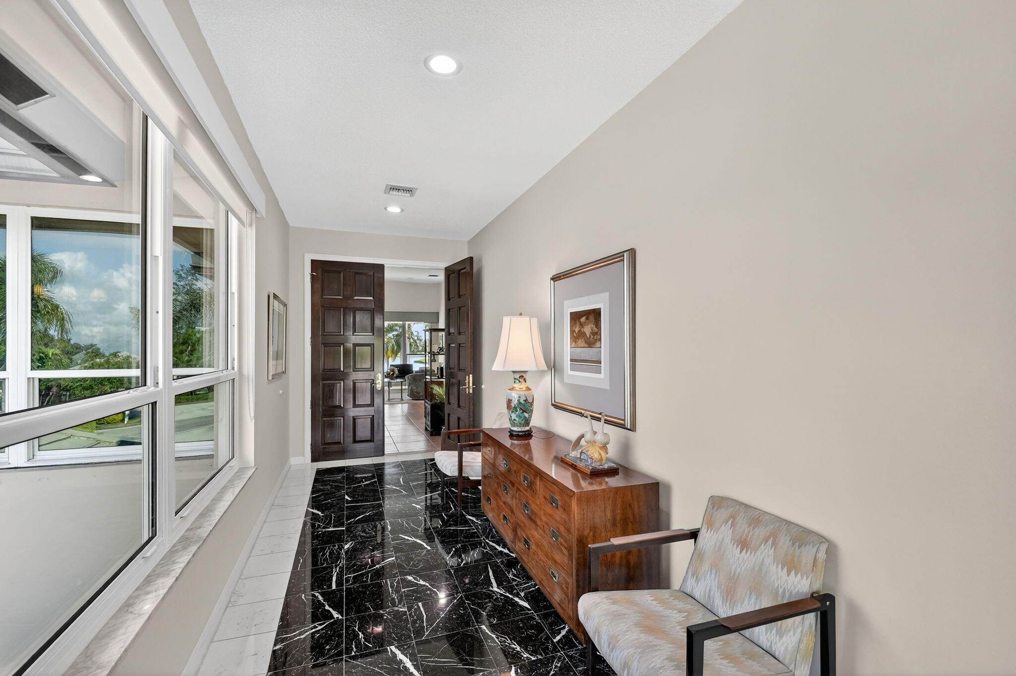 194 Orange Tree Drive, Unit G Atlantis, FL 33462 - Photo 29 of 36 a living room with furniture