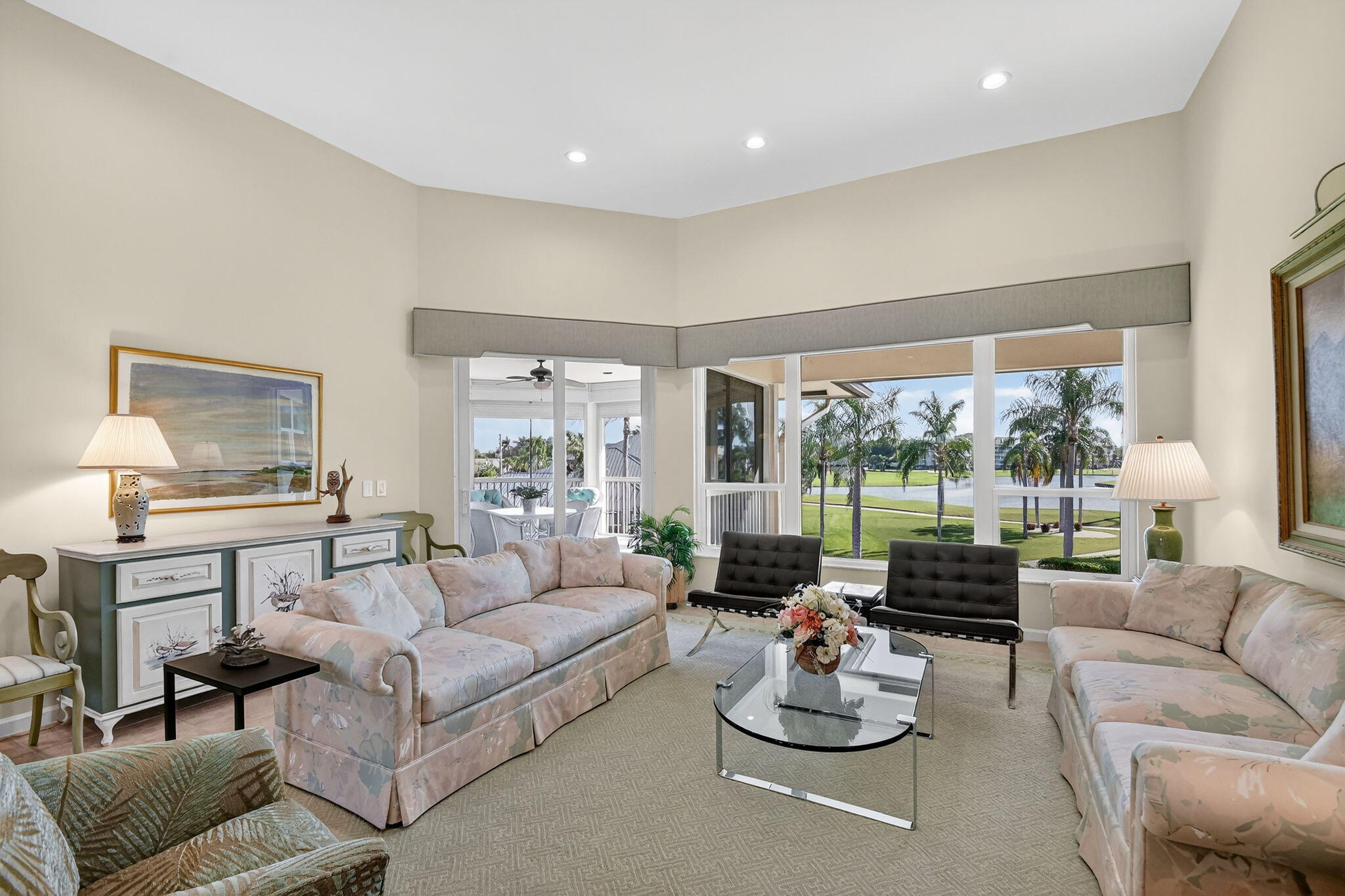 194 Orange Tree Drive, Unit G Atlantis, FL 33462 - Photo 4 of 36 a living room with furniture and a large window