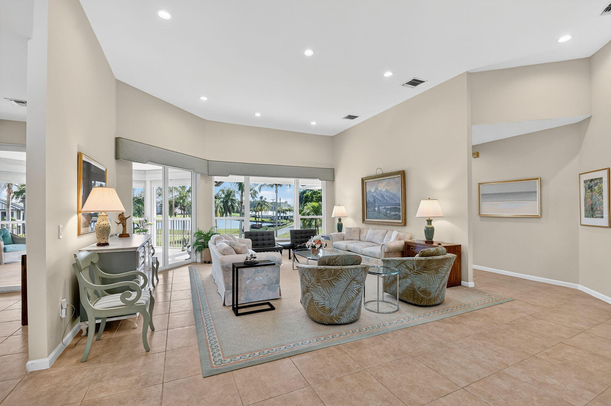 194 Orange Tree Drive, Unit G Atlantis, FL 33462 - Photo 5 of 36 a living room with fireplace furniture and a large window