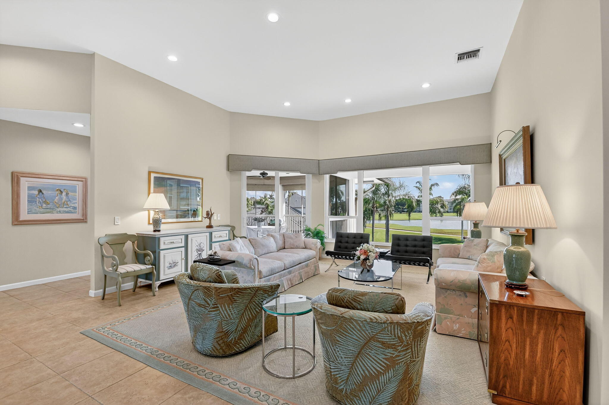 194 Orange Tree Drive, Unit G Atlantis, FL 33462 - Photo 6 of 36 a living room with furniture and a large window