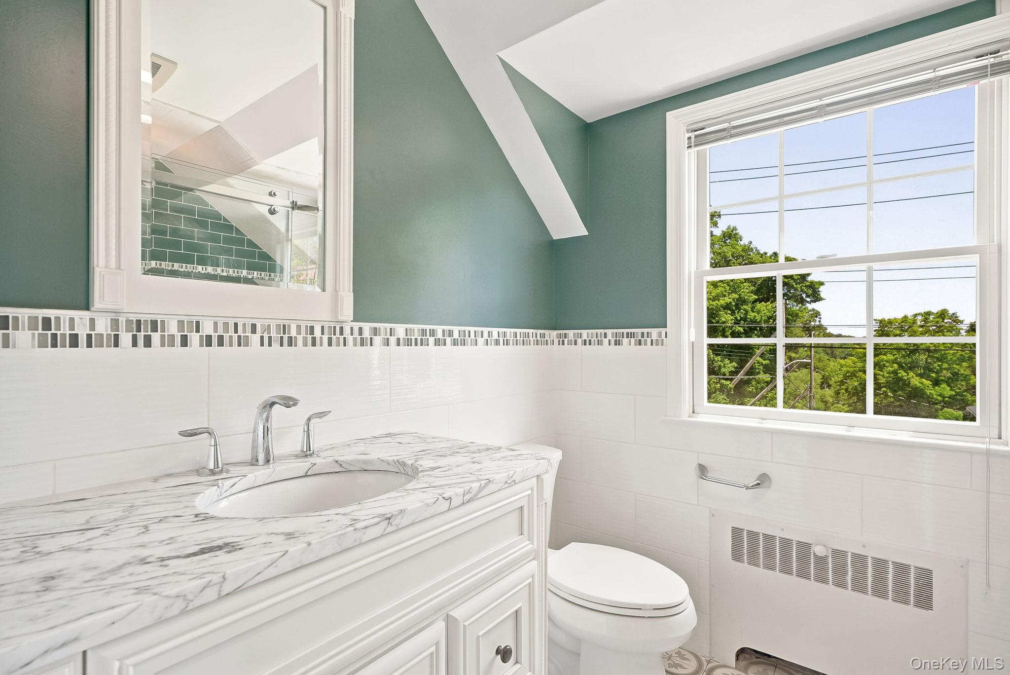 1 Sheridan Road Scarsdale, NY 10583 - Photo 28 of 40 Beautiful second floor hall bath with tree top views