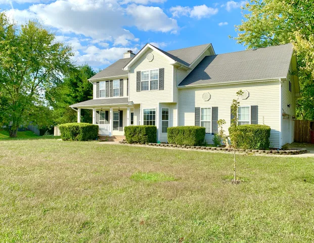 a front view of a house with a yard