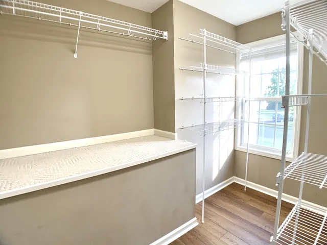 a white bath tub sitting next to a window