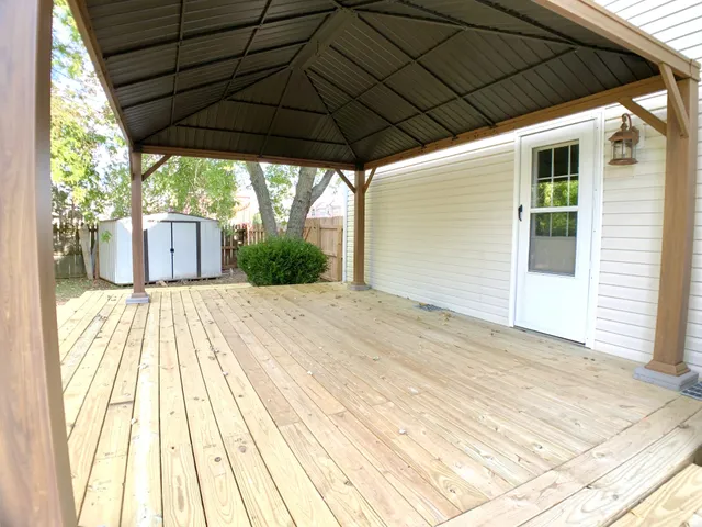 a view of a house with a yard and plant