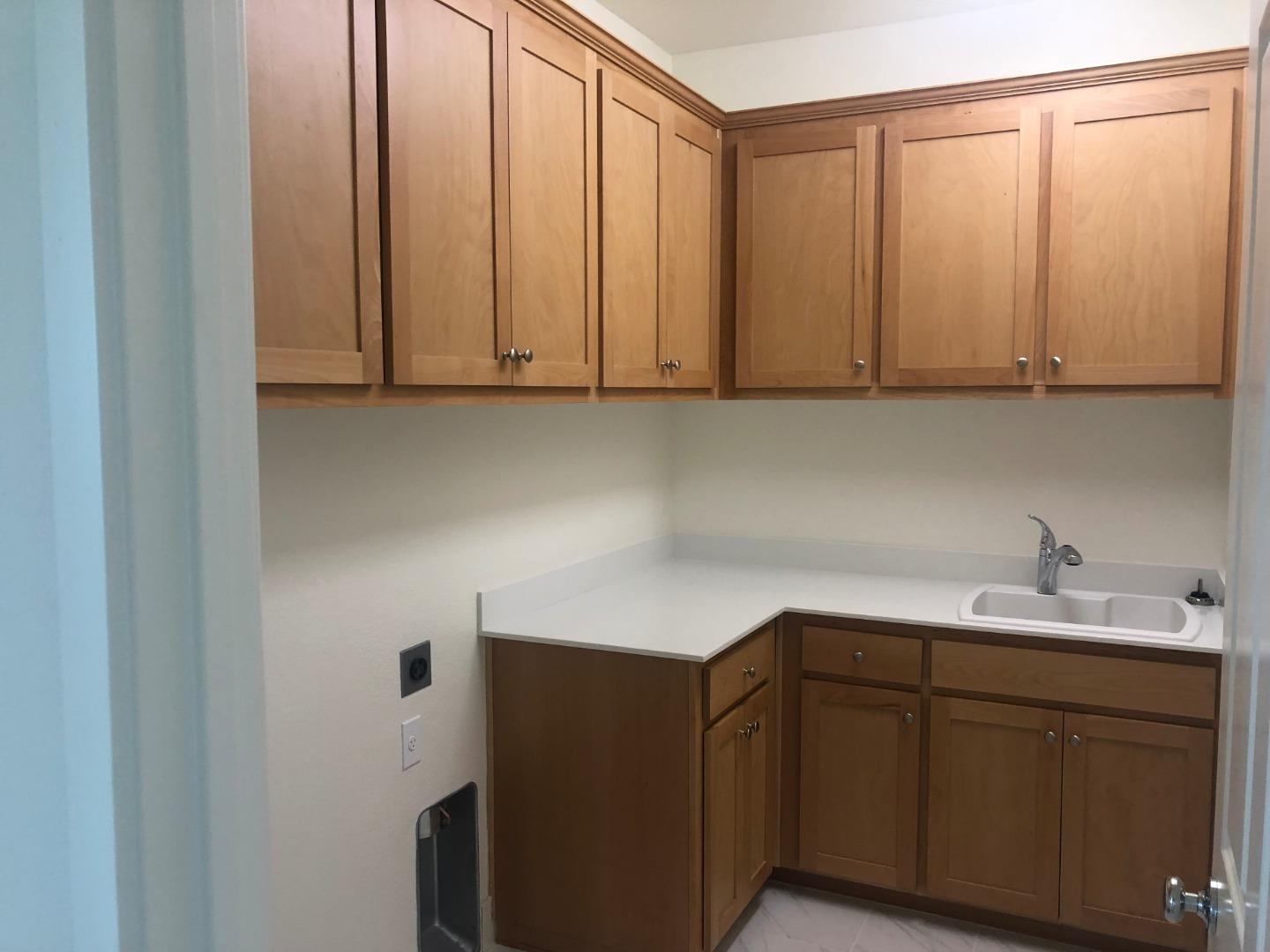 950 Puma Way Gilroy, CA 95020 - Photo 13 of 17 a kitchen with a sink and cabinets