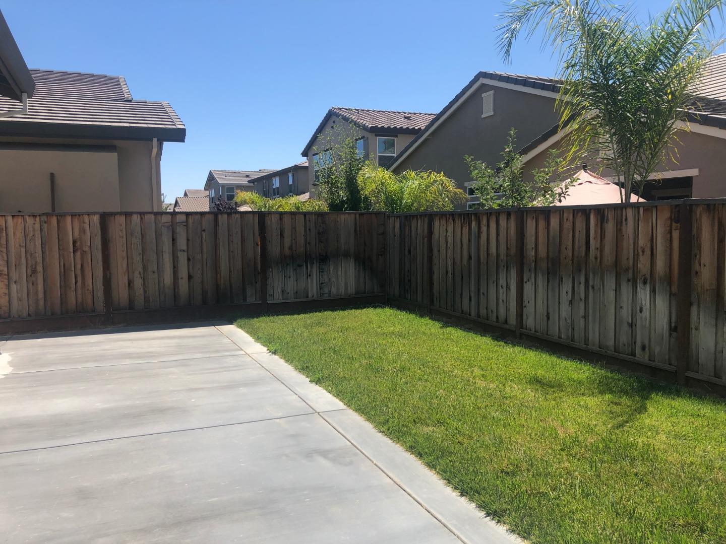 950 Puma Way Gilroy, CA 95020 - Photo 16 of 17 a view of backyard with wooden fence