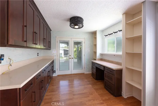a kitchen with stainless steel appliances granite countertop a sink and a stove