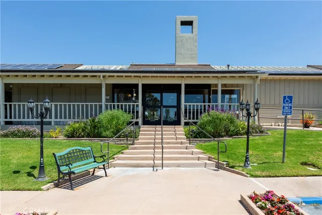 a view of a house with backyard and porch