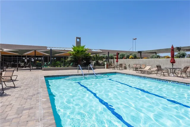 a view of a swimming pool and a patio
