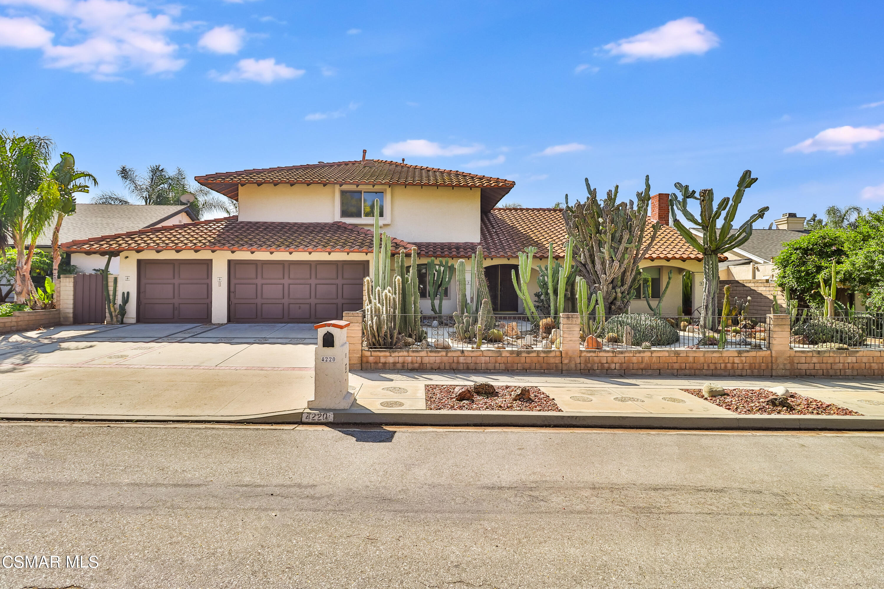 4220 Springfield Street Simi Valley, CA 93063 - Photo 18 of 95 a front view of a house with a garden and yard