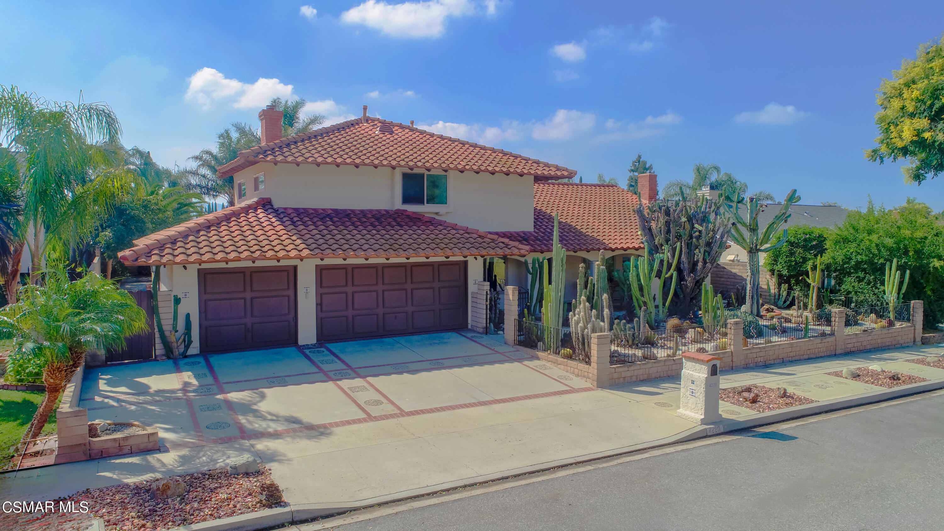 4220 Springfield Street Simi Valley, CA 93063 - Photo 3 of 95 a view of a house with a yard and potted plants