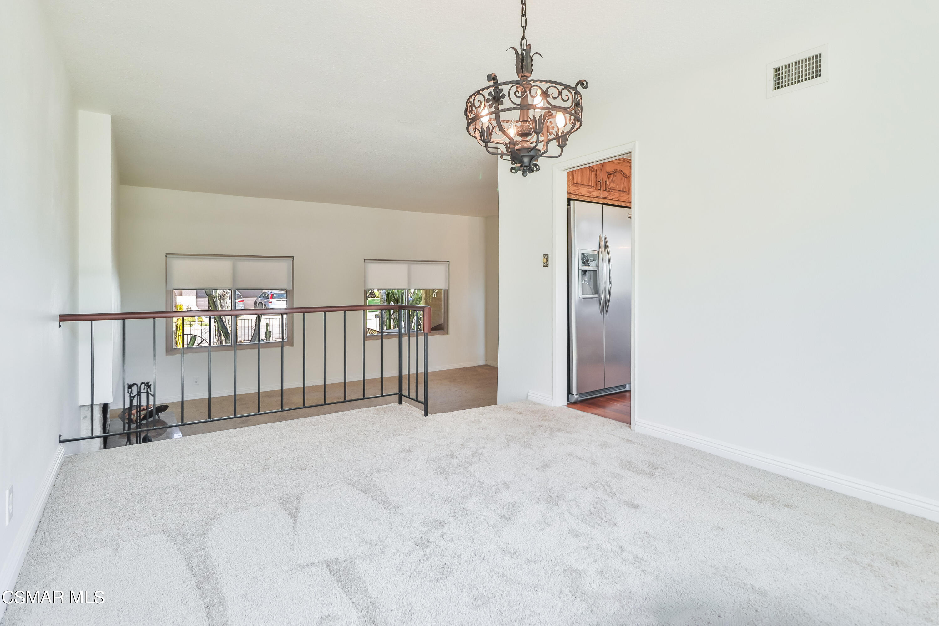 4220 Springfield Street Simi Valley, CA 93063 - Photo 33 of 95 a view of a hallway with a chandelier