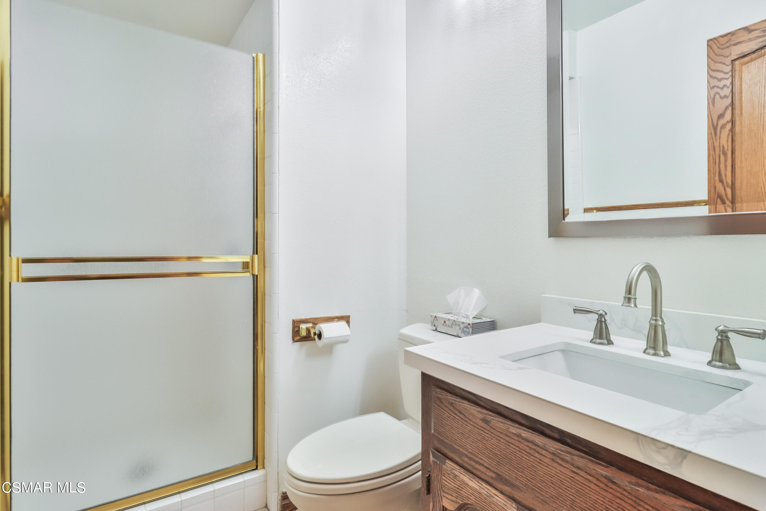 4220 Springfield Street Simi Valley, CA 93063 - Photo 48 of 95 a bathroom with a sink a toilet and a mirror