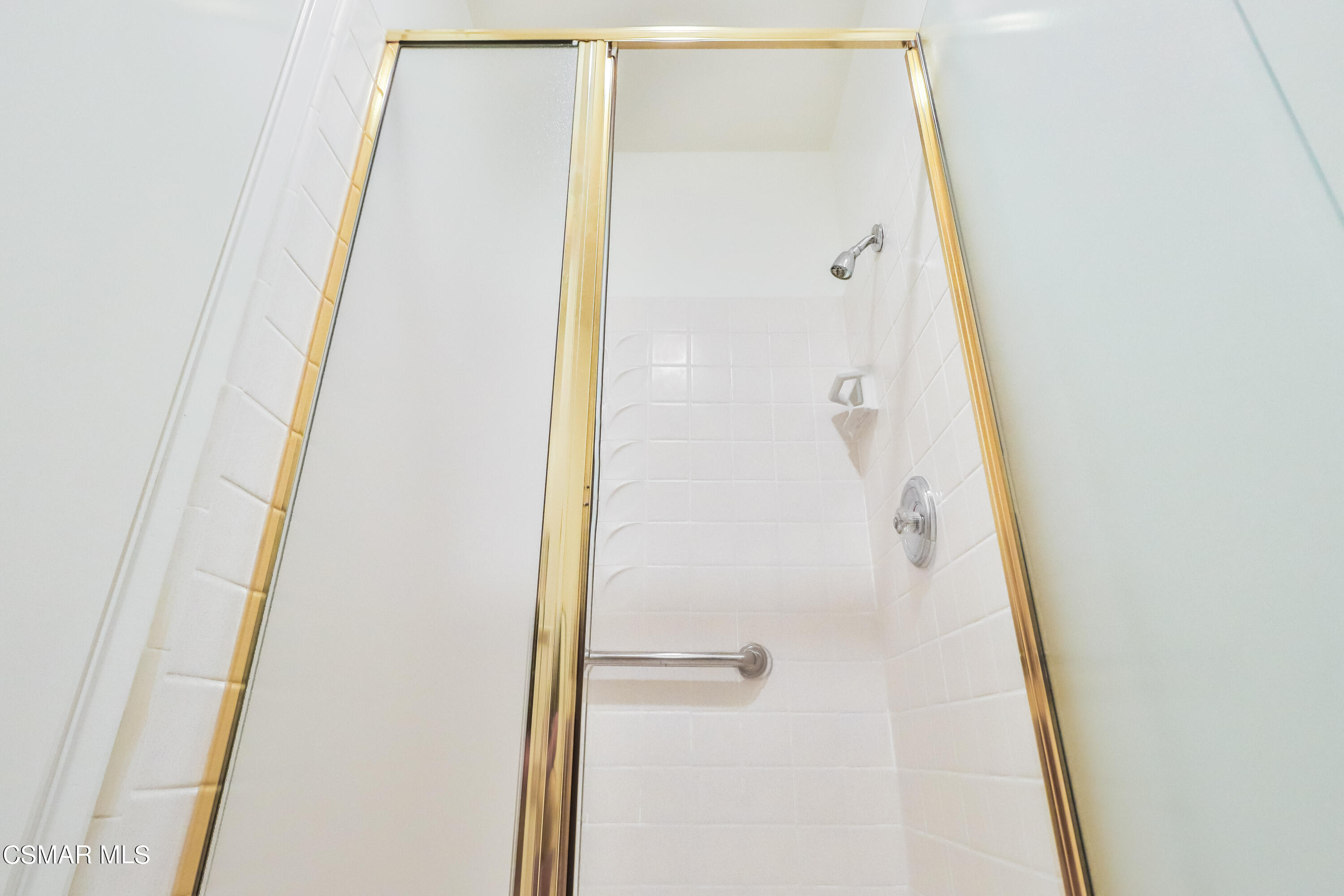 4220 Springfield Street Simi Valley, CA 93063 - Photo 79 of 95 a bathroom with a shower and a glass door