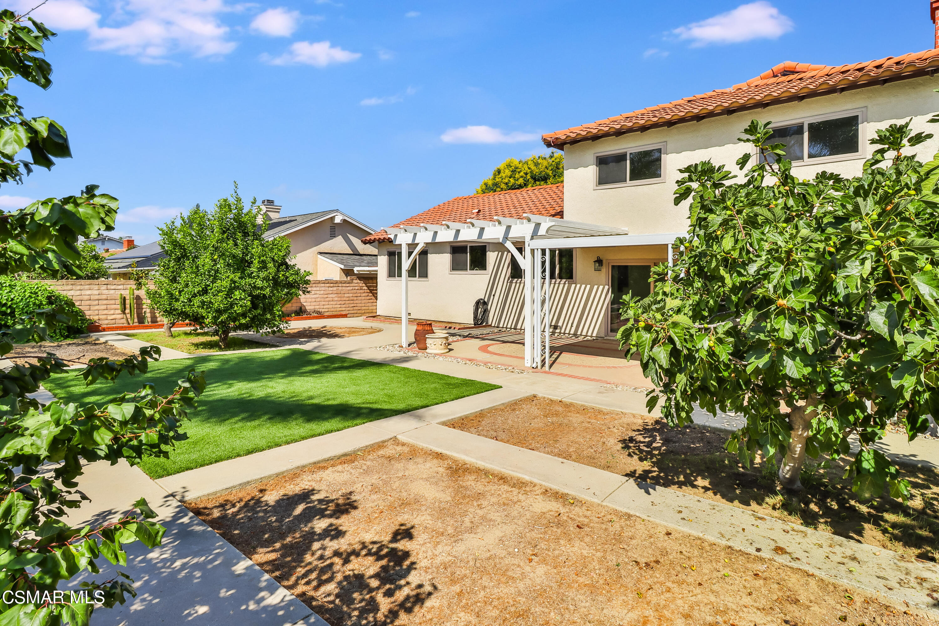4220 Springfield Street Simi Valley, CA 93063 - Photo 86 of 95 a front view of a house with a yard and garage