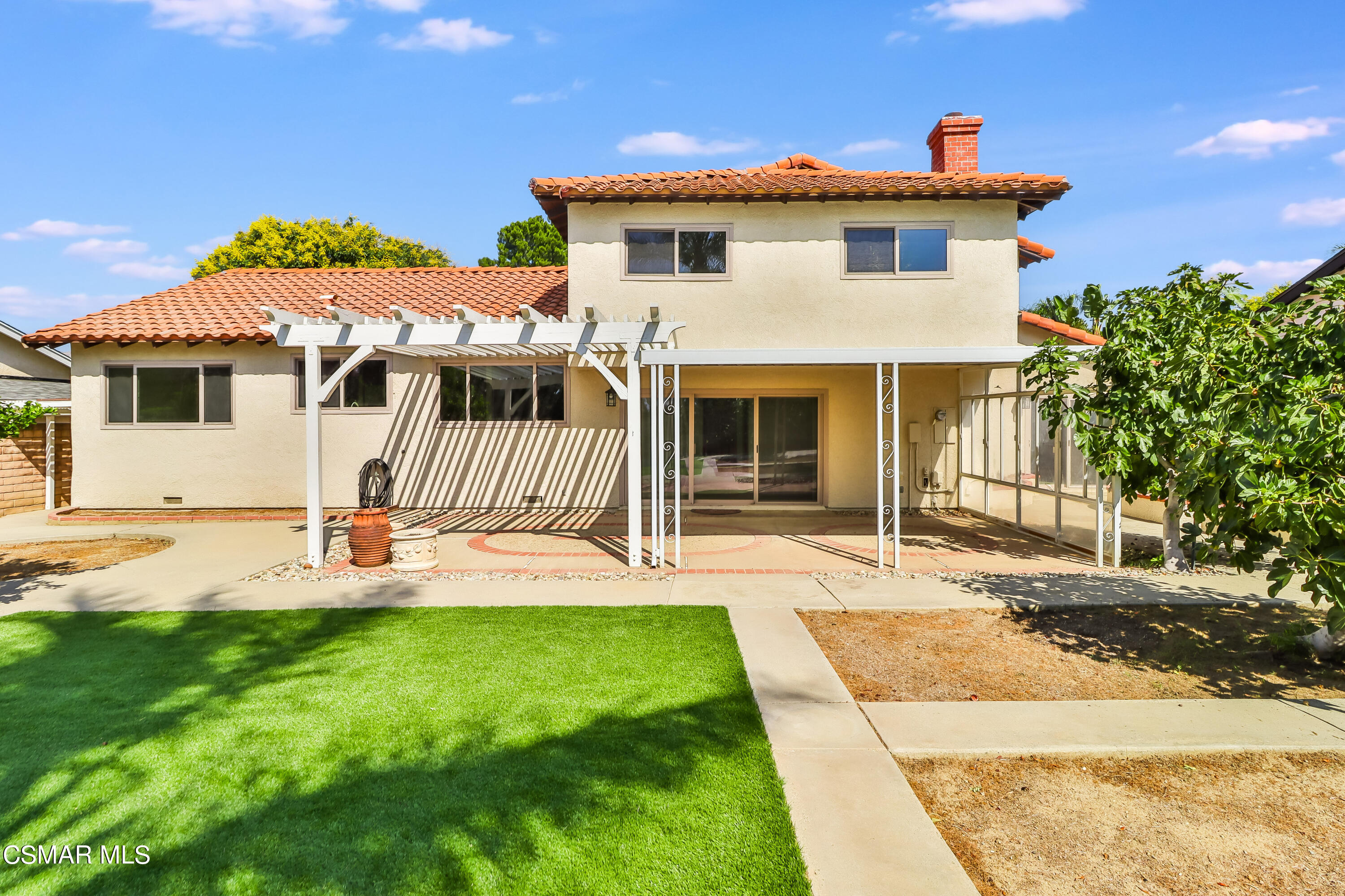 4220 Springfield Street Simi Valley, CA 93063 - Photo 87 of 95 a front view of a house with a yard and garage