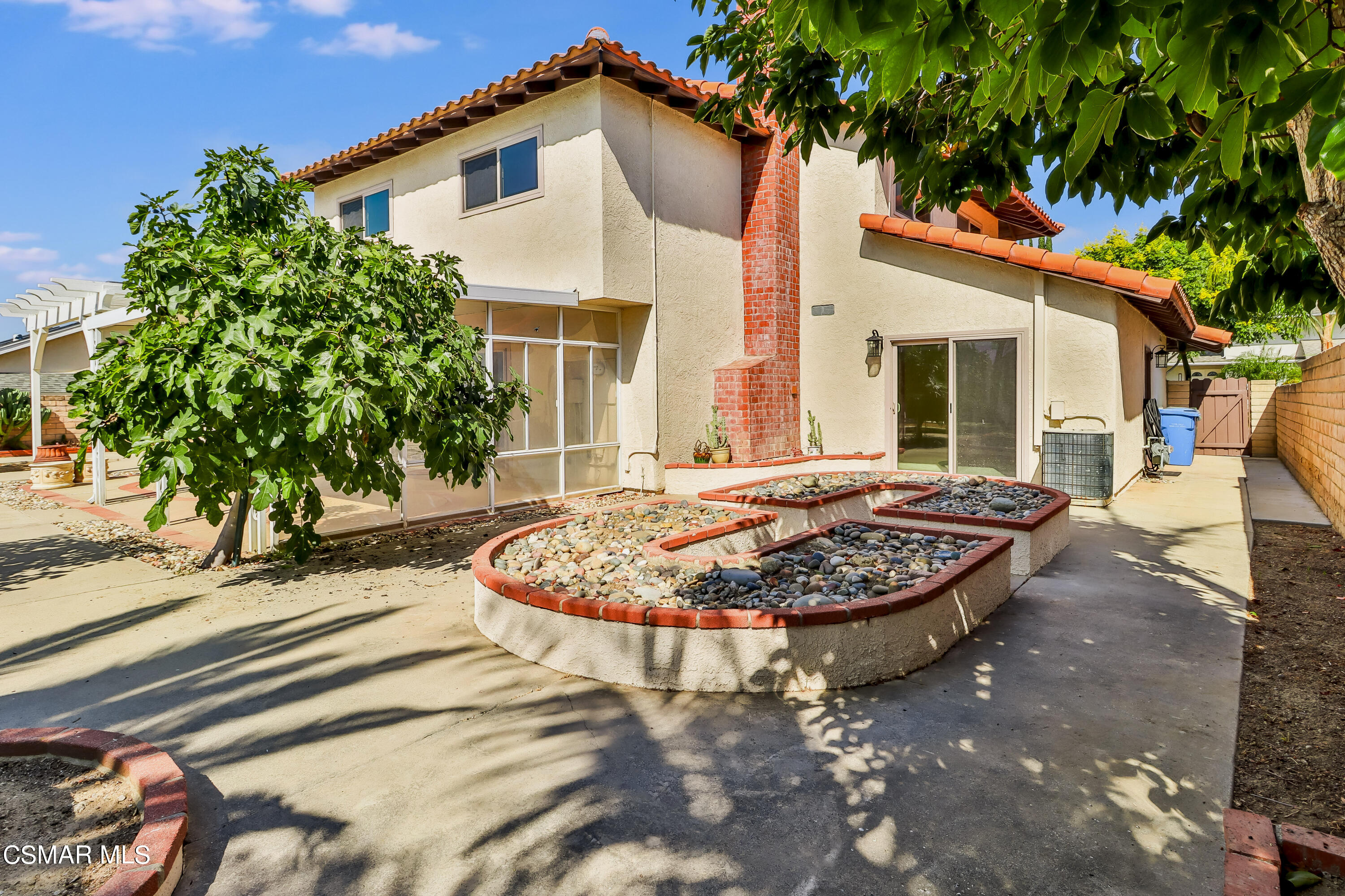 4220 Springfield Street Simi Valley, CA 93063 - Photo 93 of 95 a view of a white house with a swimming pool and sitting area
