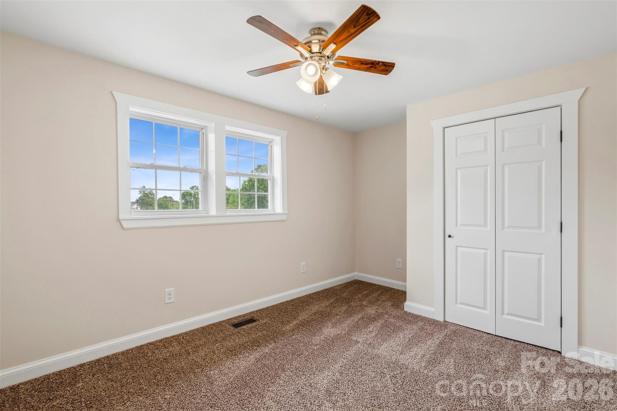 2480 Artz Road Salisbury, NC 28146 - Photo 16 of 33 an empty room with a window and a ceiling fan