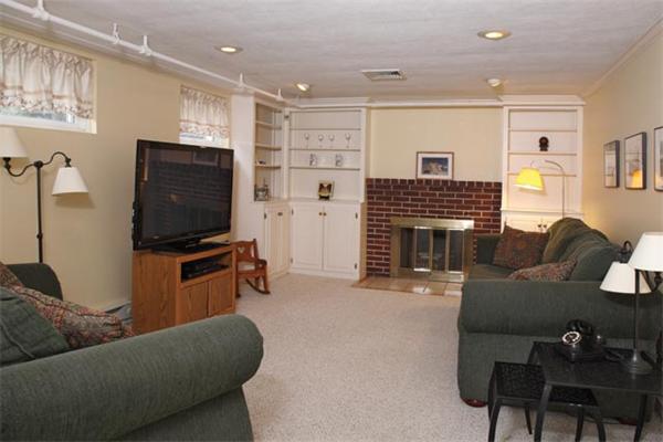 41 Bird Street Needham, MA 02492 - Photo 4 of 6 a living room with furniture and a flat screen tv