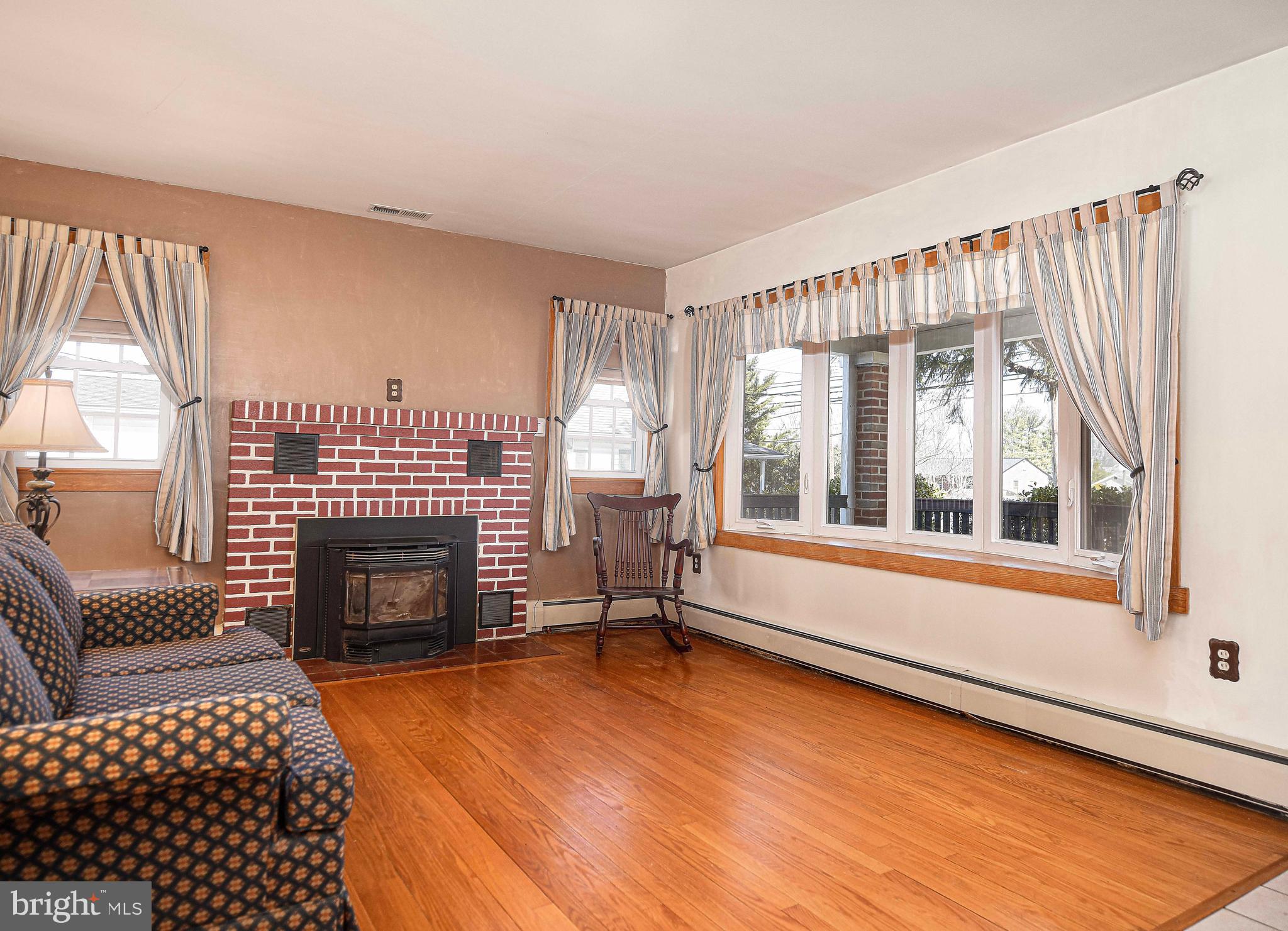 922 Rock Spring Road Bel Air, MD 21014 - Photo 11 of 69 a living room with furniture and a fireplace