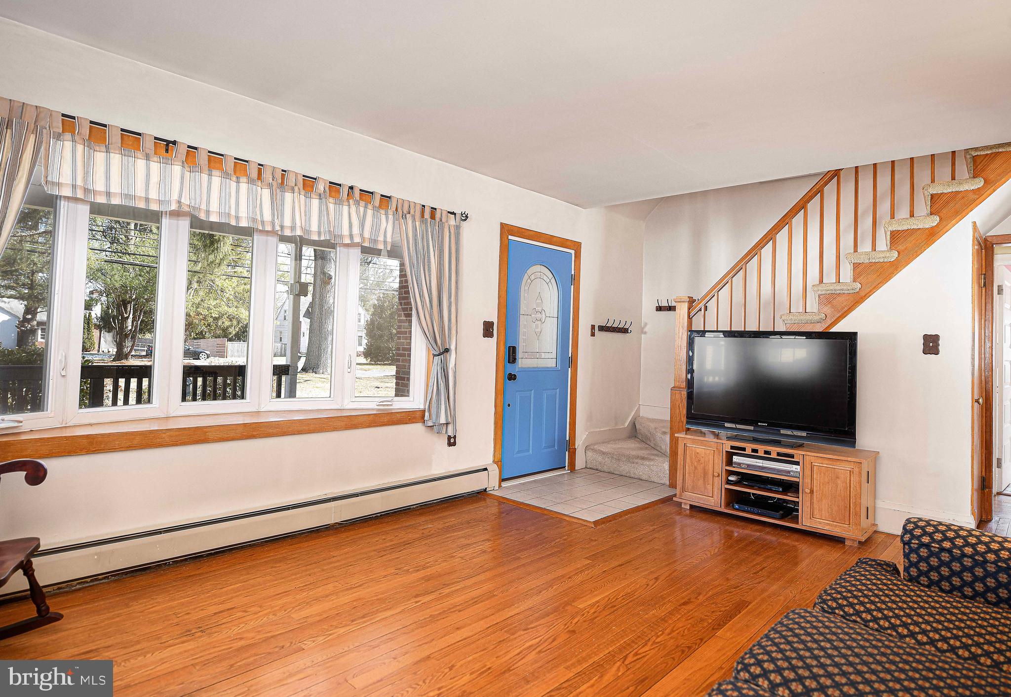 922 Rock Spring Road Bel Air, MD 21014 - Photo 12 of 69 a living room with furniture and a flat screen tv