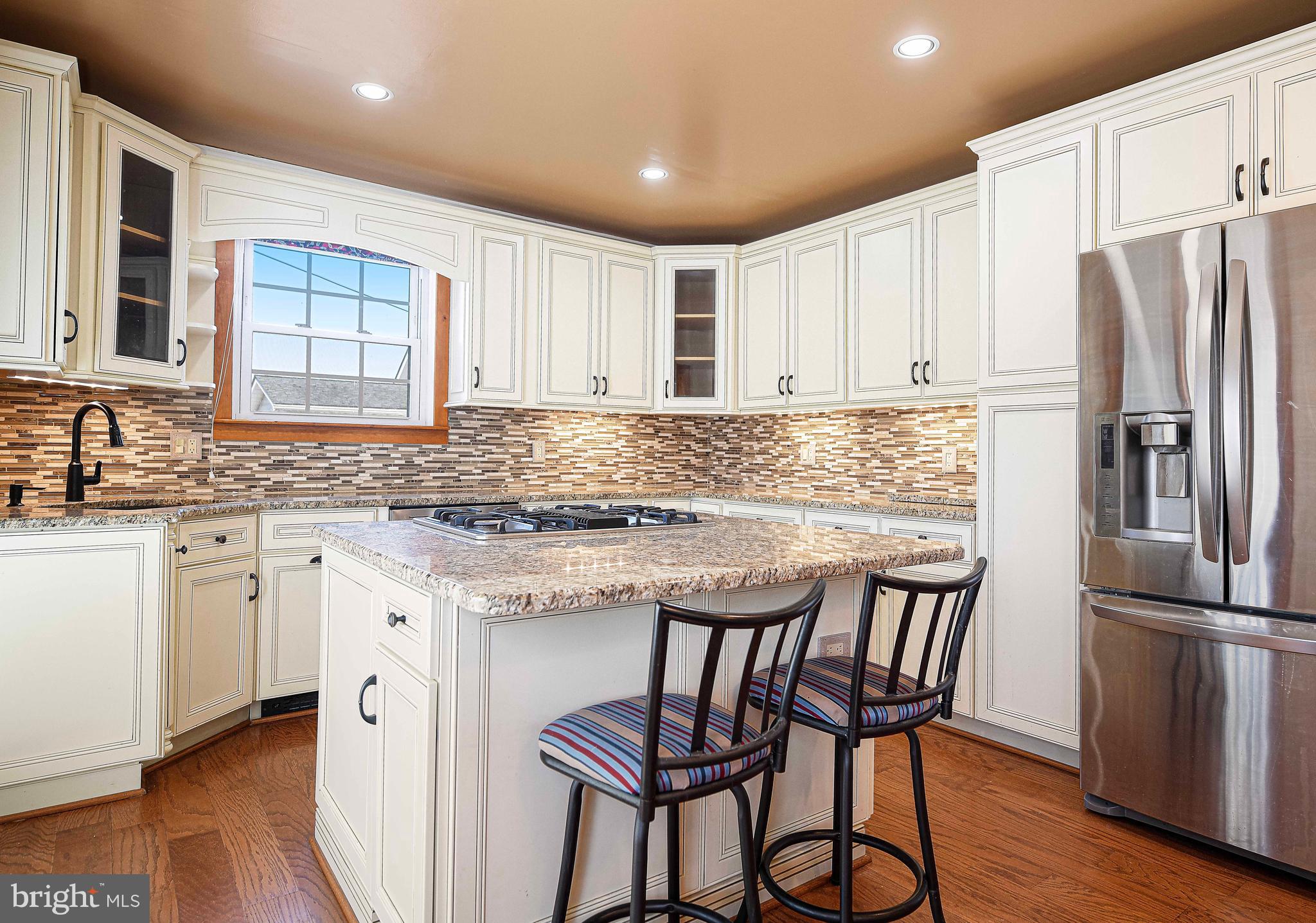922 Rock Spring Road Bel Air, MD 21014 - Photo 16 of 69 a kitchen with stainless steel appliances granite countertop a kitchen island hardwood floor sink and stove