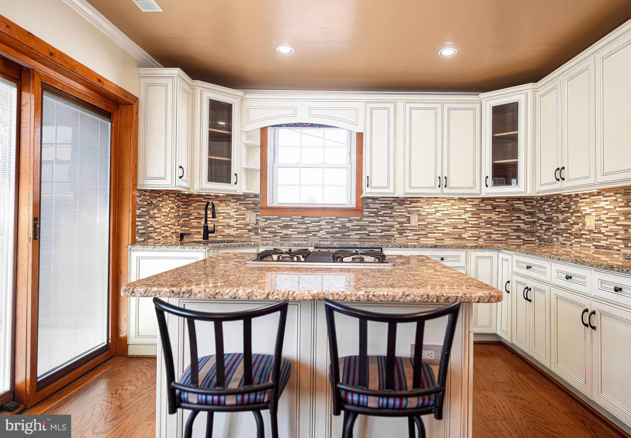 922 Rock Spring Road Bel Air, MD 21014 - Photo 17 of 69 a kitchen with stainless steel appliances granite countertop a dining table chairs and granite counter tops
