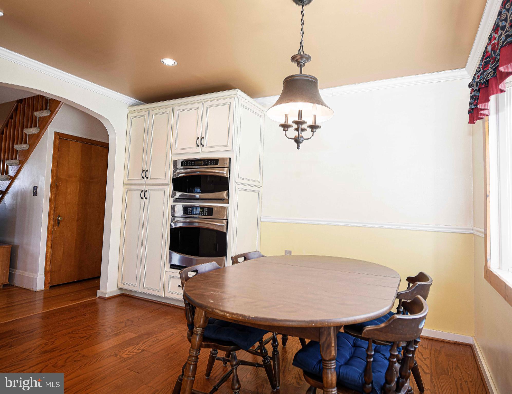922 Rock Spring Road Bel Air, MD 21014 - Photo 19 of 69 a view of a dining room with furniture and wooden floor