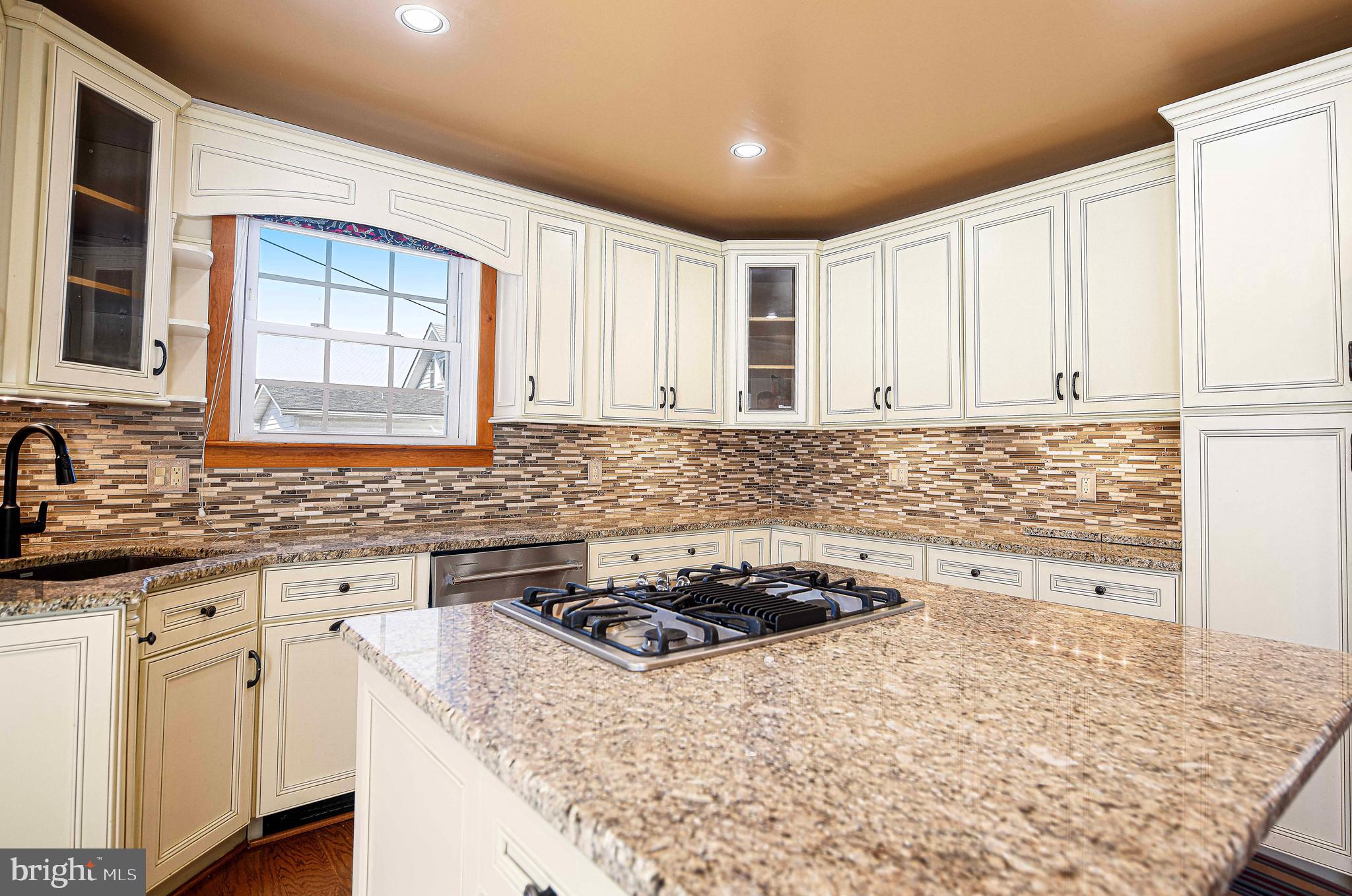 922 Rock Spring Road Bel Air, MD 21014 - Photo 20 of 69 a kitchen with granite countertop a sink stove and cabinets