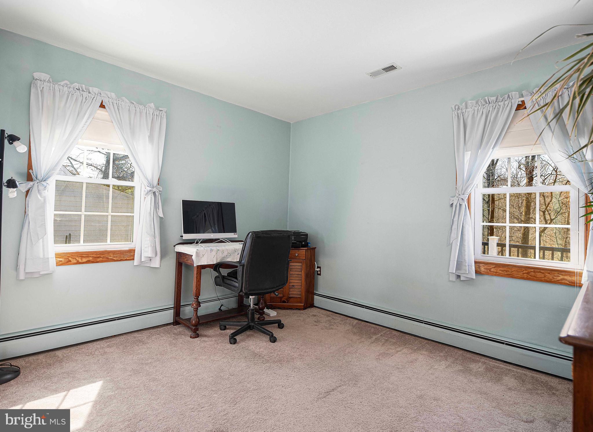 922 Rock Spring Road Bel Air, MD 21014 - Photo 25 of 69 a view of a workspace with furniture and a window