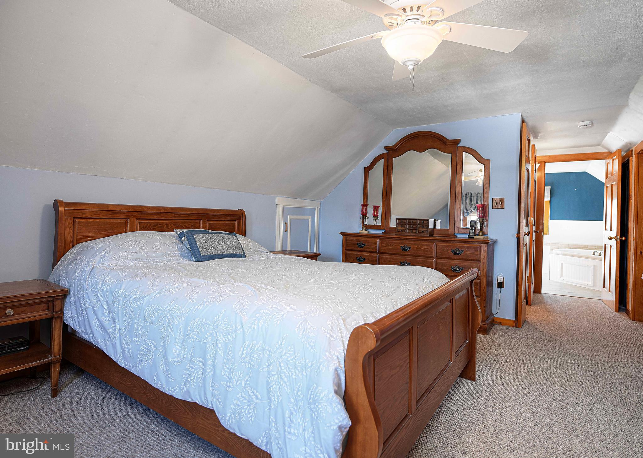 922 Rock Spring Road Bel Air, MD 21014 - Photo 26 of 69 a bedroom with a bed and a mirror on dresser