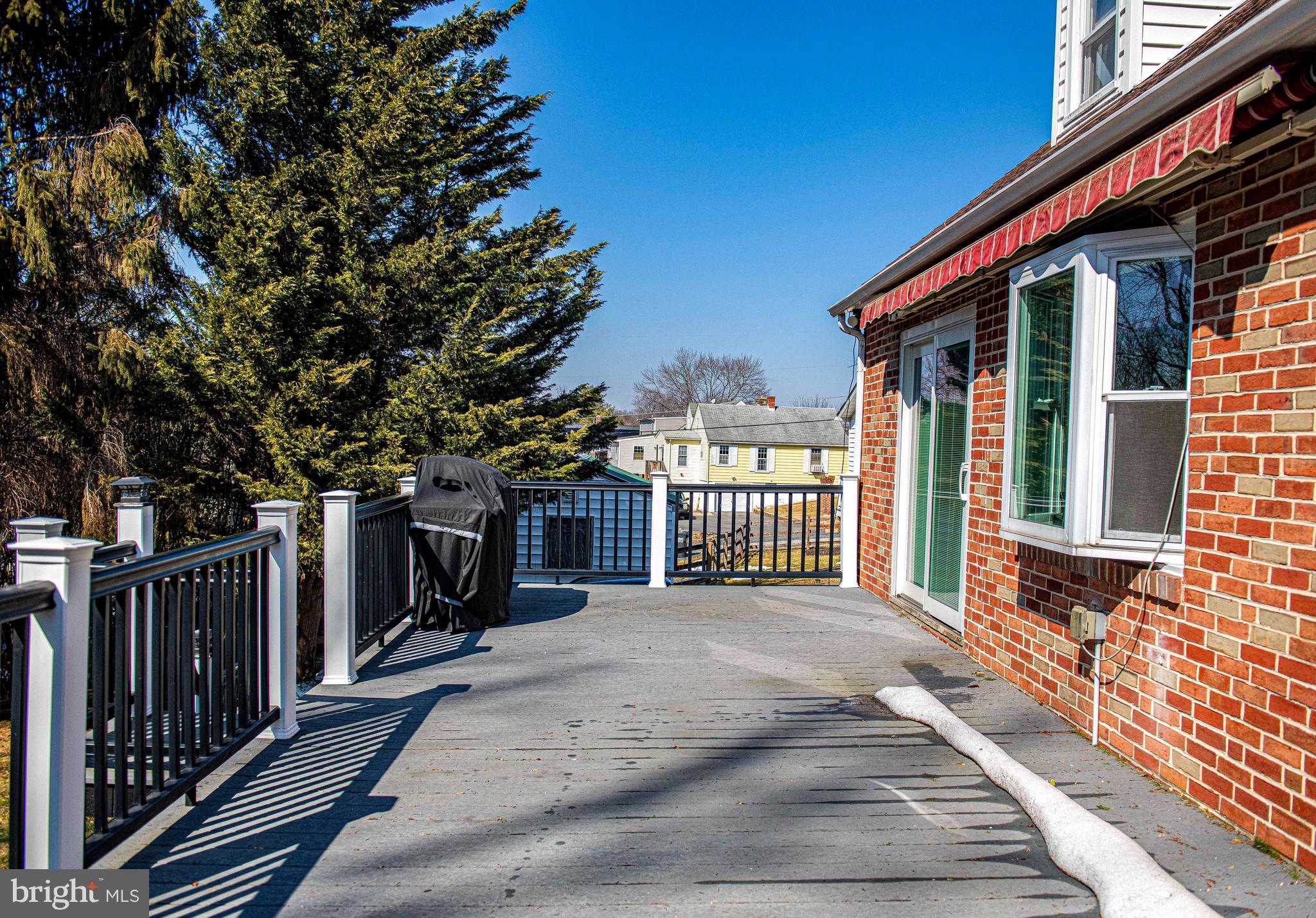 922 Rock Spring Road Bel Air, MD 21014 - Photo 33 of 69 a view of a house with a small yard and wooden fence