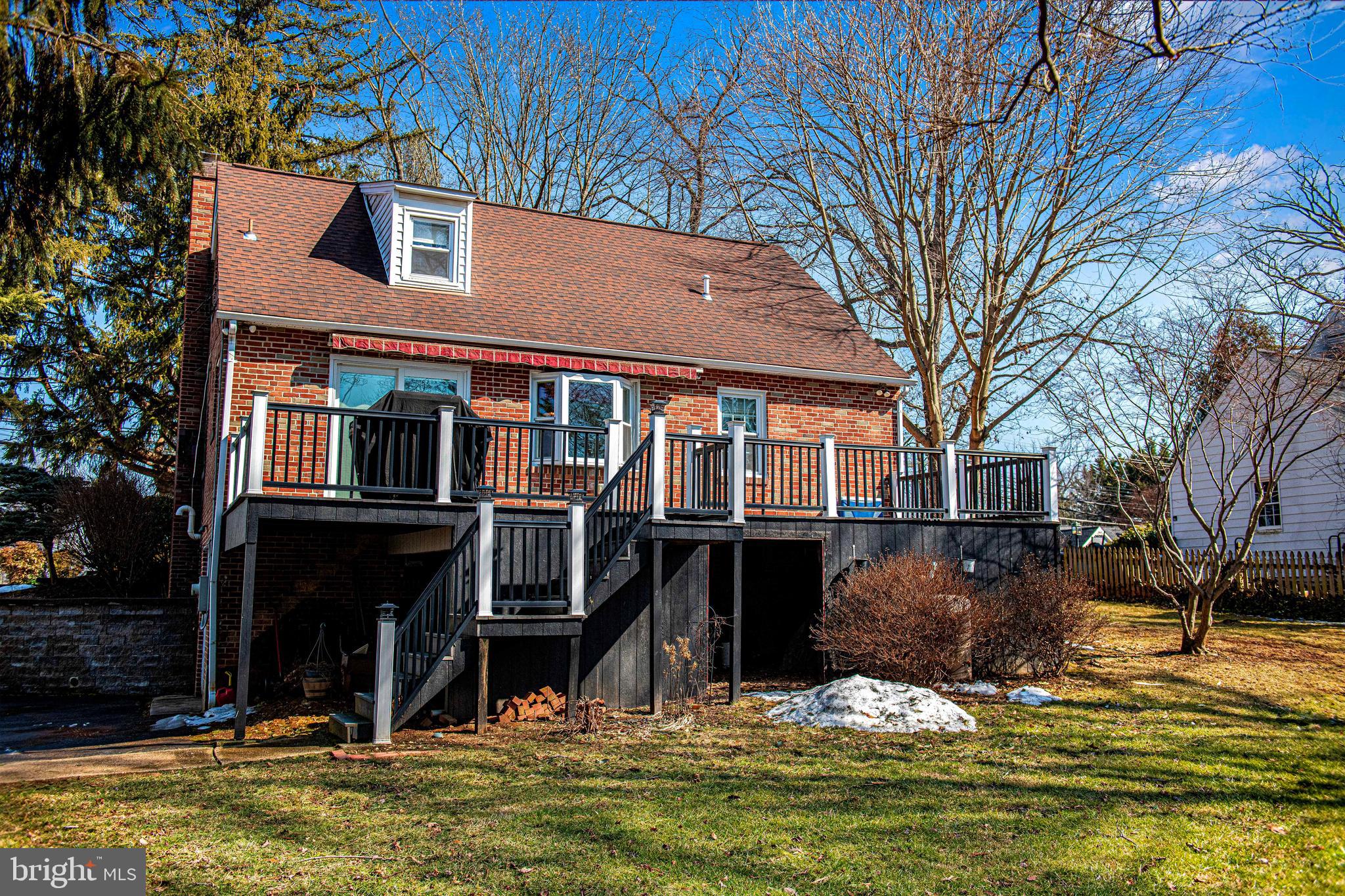 922 Rock Spring Road Bel Air, MD 21014 - Photo 43 of 69 a front view of a house with a yard covered with snow