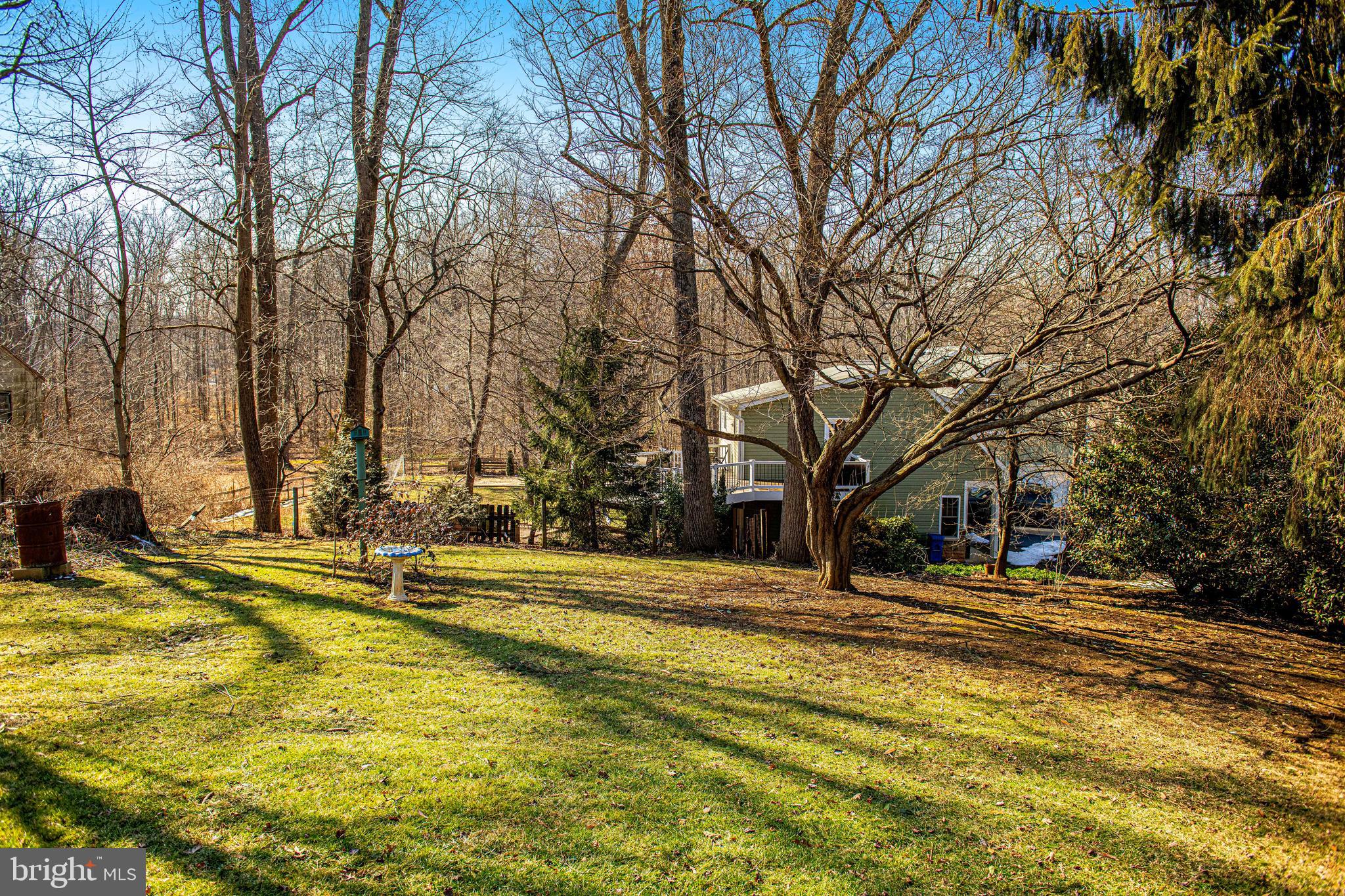 922 Rock Spring Road Bel Air, MD 21014 - Photo 45 of 69 a yellow house with trees in front of it