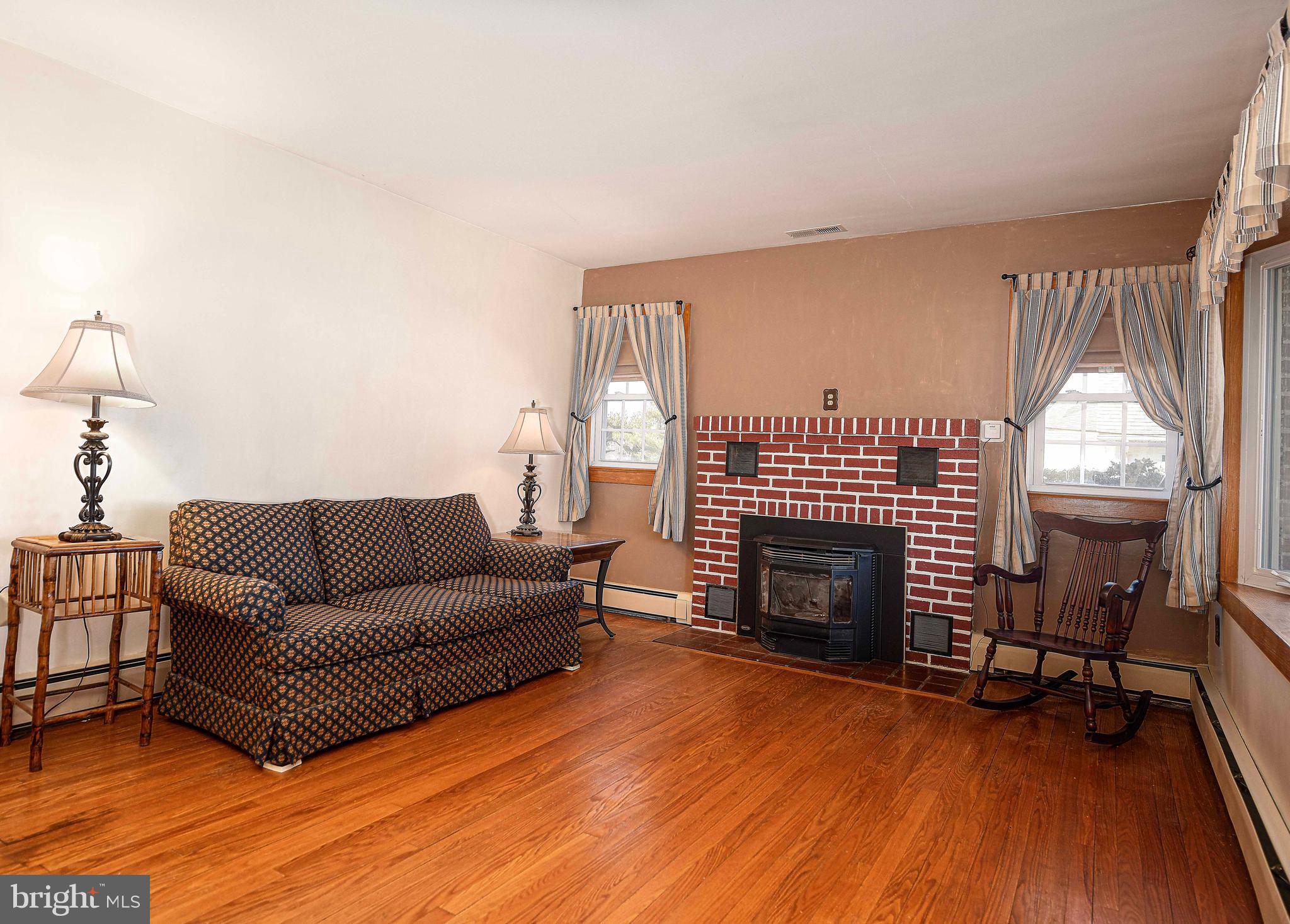 922 Rock Spring Road Bel Air, MD 21014 - Photo 10 of 69 a living room with furniture and a fireplace