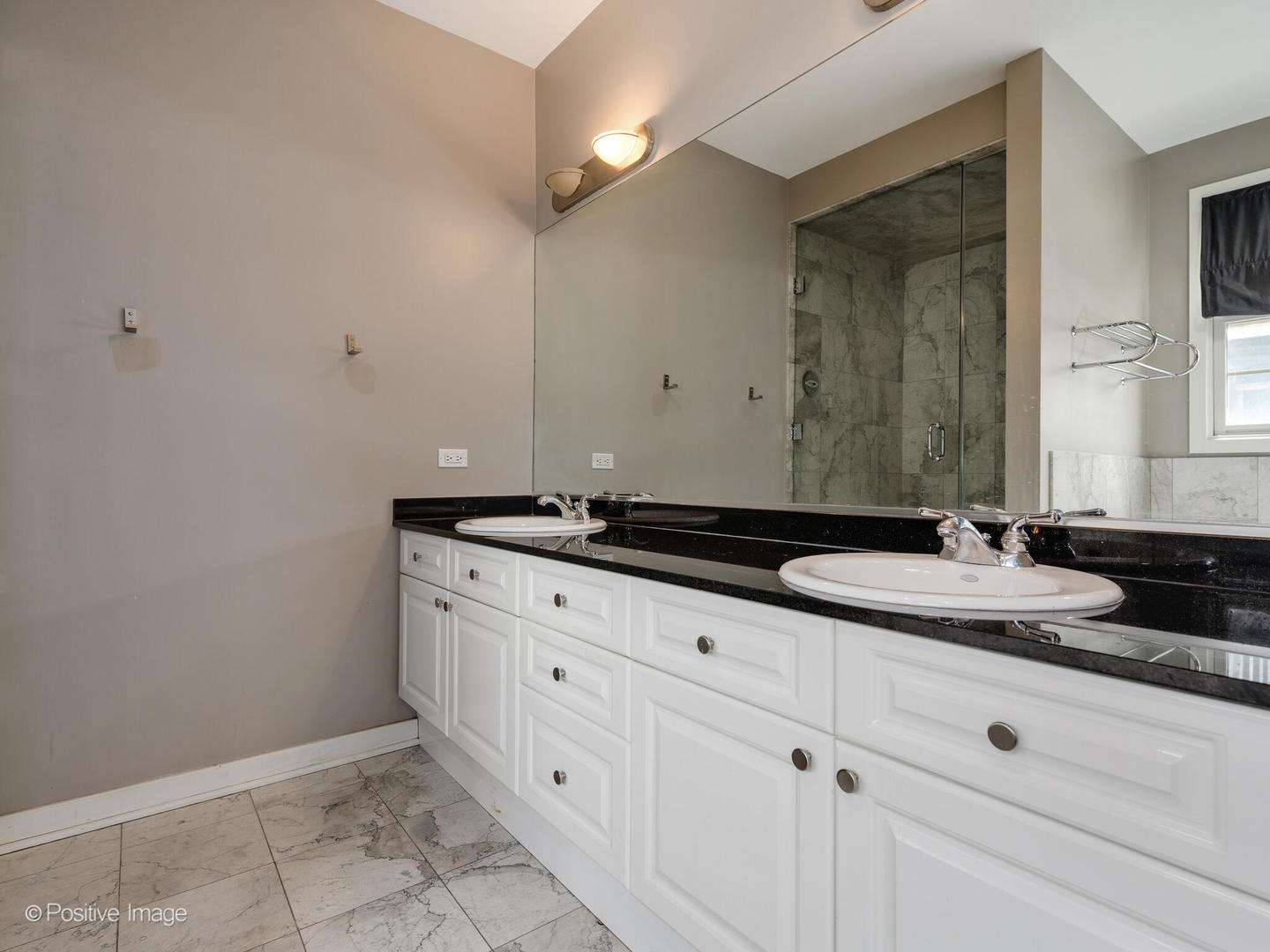 18 North Ada Street, Unit C Chicago, IL 60607 - Photo 17 of 28 a bathroom with a sink and a mirror