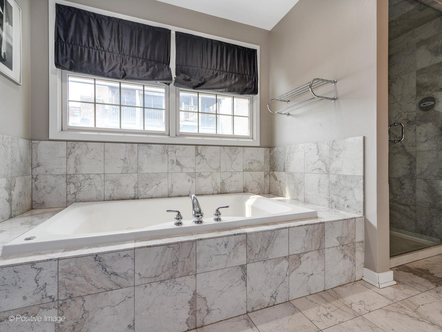 18 North Ada Street, Unit C Chicago, IL 60607 - Photo 18 of 28 a bathroom with a bathtub and shower